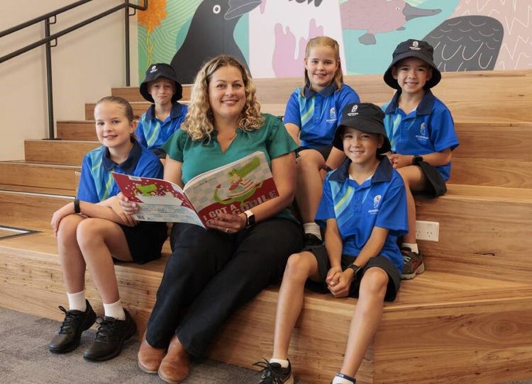 Principal reading to students